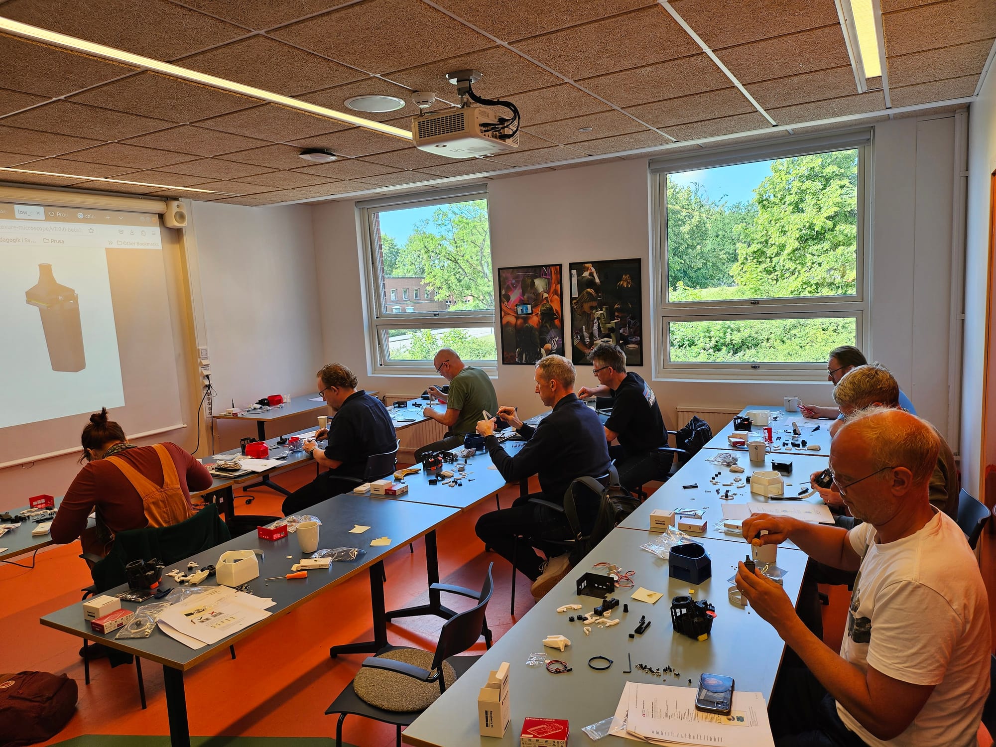 Photo of attendees working on their microscopes at the workshop